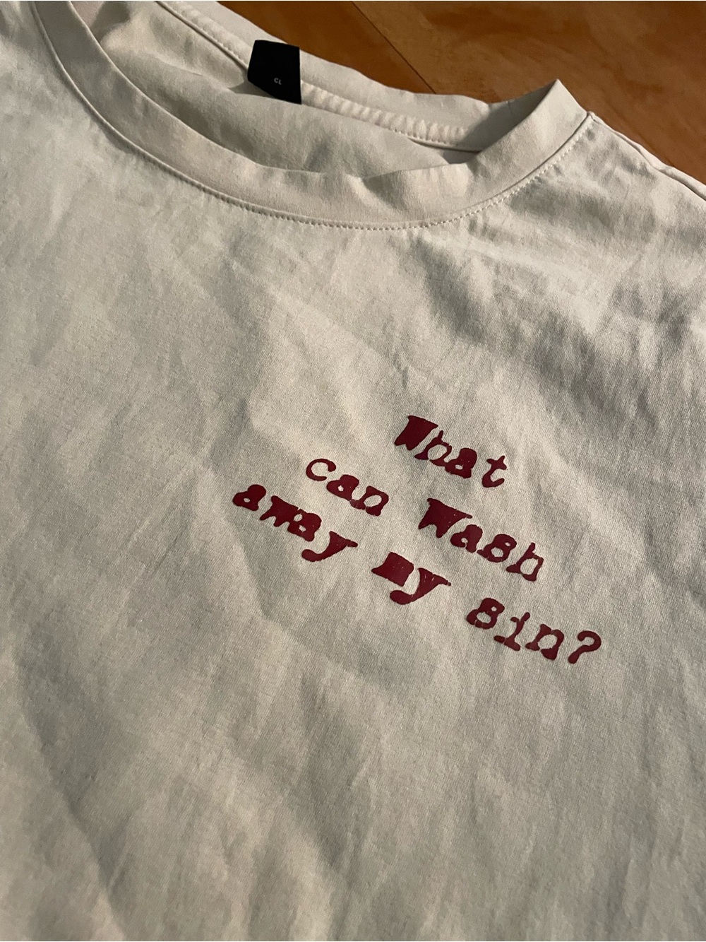 White Short-Sleeve Graphic Tee with Red Chest Text